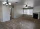 Open living room with fireplace, neutral carpeting and traditional chandelier lighting at 2020 Mesquite Ln # 205, Laughlin, NV 89029