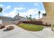Backyard featuring synthetic grass and brick firepits at 2046 Waverly Cir, Henderson, NV 89014