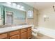 Bathroom with neutral walls, a shower-tub combo, granite countertop, and vanity cabinet at 2046 Waverly Cir, Henderson, NV 89014