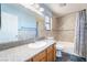 Bathroom featuring a granite countertop, ceramic tile backsplash, and tub with shower at 2046 Waverly Cir, Henderson, NV 89014