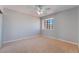 Bright bedroom with neutral walls, carpet, and a window with views of the neighborhood at 2046 Waverly Cir, Henderson, NV 89014