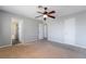 Spacious bedroom featuring a ceiling fan and neutral carpeting at 2046 Waverly Cir, Henderson, NV 89014