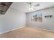 Bedroom with neutral walls, carpet, ceiling fan, and neighborhood views at 2046 Waverly Cir, Henderson, NV 89014