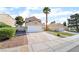 Charming single-Gathering home boasts a two-car garage and a well-manicured front yard in a suburban neighborhood at 2046 Waverly Cir, Henderson, NV 89014