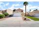 Charming single-Gathering home boasts a two-car garage and a well-manicured front yard in a suburban neighborhood at 2046 Waverly Cir, Henderson, NV 89014