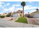Charming single-Gathering home boasts a two-car garage and a well-manicured front yard in a suburban neighborhood at 2046 Waverly Cir, Henderson, NV 89014