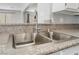 Stainless steel double sink with granite countertop and modern faucet at 2046 Waverly Cir, Henderson, NV 89014