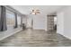 The spacious living room features wood-look flooring, neutral walls, natural light, and modern ceiling fans at 2046 Waverly Cir, Henderson, NV 89014