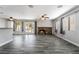 The open-concept living area features wood-look floors, a stone fireplace, and access to the outdoor patio at 2046 Waverly Cir, Henderson, NV 89014