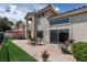 Inviting back patio with lake views, offering a perfect blend of indoor-outdoor living at 2529 Seascape Dr, Las Vegas, NV 89128