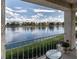 Enjoy the serene view of the lake from the balcony, complete with a cozy table at 2529 Seascape Dr, Las Vegas, NV 89128