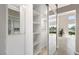 Bright room with view of lake from attached balcony, decorative plant at 2529 Seascape Dr, Las Vegas, NV 89128