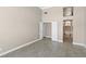 Bright bedroom with tile floors, closet, and adjacent luxurious bath with arched window at 2529 Seascape Dr, Las Vegas, NV 89128