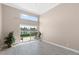 Bedroom with large windows, lake view, and access to a patio at 2529 Seascape Dr, Las Vegas, NV 89128