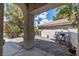 Charming courtyard with patterned pavers, seating, potted plants, and architectural pillars at 2529 Seascape Dr, Las Vegas, NV 89128