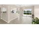 Open dining area with views of the lake, neutral paint, and tile flooring at 2529 Seascape Dr, Las Vegas, NV 89128