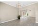 Spacious living room with tile flooring, high ceilings, and sliding glass doors at 2529 Seascape Dr, Las Vegas, NV 89128