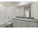 Bright bathroom featuring a single vanity and a tub and shower combo at 2611 Freya Valley St, Las Vegas, NV 89156