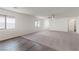 Open-concept living room with neutral carpet, ceiling fan, and view of kitchen and dining at 2611 Freya Valley St, Las Vegas, NV 89156