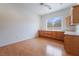 This bonus room features ample cabinet and counter space, with a large window for natural light at 308 Kingsclear Ct, Las Vegas, NV 89145