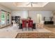 Bright dining area with a glass table and unique red chairs at 308 Kingsclear Ct, Las Vegas, NV 89145