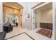 Spacious foyer featuring tile flooring, arched entryways, and a view into adjacent living spaces at 308 Kingsclear Ct, Las Vegas, NV 89145