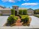 Charming single-story home with manicured landscaping, a three-car garage, and a welcoming entrance at 308 Kingsclear Ct, Las Vegas, NV 89145