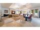 Large living room with stylish furniture, a ceiling fan, and plenty of natural light at 308 Kingsclear Ct, Las Vegas, NV 89145