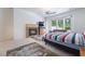 A well-lit main bedroom features a fireplace, seating area, and a large window for great natural light at 308 Kingsclear Ct, Las Vegas, NV 89145