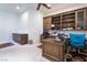 Inviting office space with custom shelving, a ceiling fan, and a large desk, perfect for productivity at 308 Kingsclear Ct, Las Vegas, NV 89145