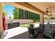 Outdoor patio with ceiling fans, furniture, and a built-in grill overlooking the backyard at 308 Kingsclear Ct, Las Vegas, NV 89145