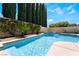 Tranquil pool and spa area with waterfall features, surrounded by lush greenery and privacy at 308 Kingsclear Ct, Las Vegas, NV 89145