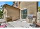 Backyard patio featuring a grill, shaded seating and a view of the home at 3141 Monet Sunrise Ave, Henderson, NV 89044