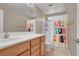 Bathroom featuring Hello Sunshine shower curtain, neutral wall and vanity at 3141 Monet Sunrise Ave, Henderson, NV 89044