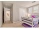 Cozy bedroom features a comfortable bed, two windows with shutters, and closet at 3141 Monet Sunrise Ave, Henderson, NV 89044