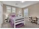 Bedroom with a bed, dresser, desk, carpet and two windows with shutters at 3141 Monet Sunrise Ave, Henderson, NV 89044