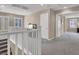 Second floor hallway with railing and carpeted floor at 3141 Monet Sunrise Ave, Henderson, NV 89044