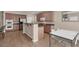 Spacious kitchen features stainless steel appliances, a breakfast bar, and a dining area at 3141 Monet Sunrise Ave, Henderson, NV 89044