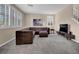 Spacious living room with a large sectional and plenty of natural light at 3141 Monet Sunrise Ave, Henderson, NV 89044