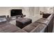 Comfortable living room featuring a sectional and a television at 3141 Monet Sunrise Ave, Henderson, NV 89044