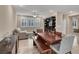Open-concept living and dining area with wood floors at 3141 Monet Sunrise Ave, Henderson, NV 89044