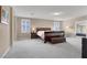 Spacious main bedroom with neutral color carpet, bedside tables and windows with shutters at 3141 Monet Sunrise Ave, Henderson, NV 89044