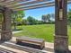 Scenic park view from a shaded bench area with well-maintained lawns and mature trees creating a serene setting at 3141 Monet Sunrise Ave, Henderson, NV 89044