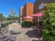 Charming outdoor restaurant patio with shaded seating, perfect for enjoying a meal in a relaxing atmosphere at 3141 Monet Sunrise Ave, Henderson, NV 89044