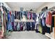 Spacious walk-in closet featuring ample storage and clothing rods at 3141 Monet Sunrise Ave, Henderson, NV 89044