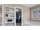 Bathroom featuring storage shelves and an entrance to a walk-in closet at 3141 Monet Sunrise Ave, Henderson, NV 89044