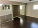 Bedroom with dark wood floors, light walls, and mirrored sliding closet doors at 3144 Downing Pl, Las Vegas, NV 89121