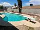 Backyard pool with diving board and concrete surround at 3144 Downing Pl, Las Vegas, NV 89121