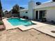 Backyard pool with multiple access points and block wall at 3144 Downing Pl, Las Vegas, NV 89121