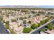 An aerial view showcasing a neighborhood with homes and scenic mountain views in the distance at 3367 Popcorn Flower St, Las Vegas, NV 89117